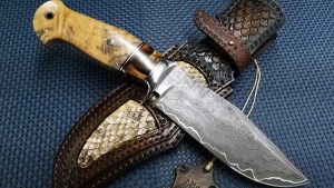 Maksim Tjulpin Forged Custom San Mai Damascus Camp Knife with Mammoth Tooth handle Made in Latvia.