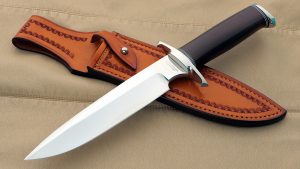 Ruffin Johnson El Lobo Solo Custom Presentation Fighter This vintage custom knife features a double-lugged guard and a faceted pommel. Ruffin made knives for 40 years.