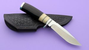 Bob Lay Custom made Canadian Hunter with Water Buffalo and Musk Ox handle Two-tone mirror and satin finish serrated thumb ramp beautiful grinds on this knife