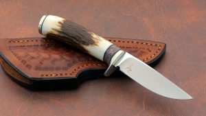 Bob Lay Caping knife is designed to be used for the delicate work around the head, neck and hooves; especially important if you plan to save the hide for a mount. Small custom made hunter with stag handle.